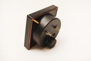 Measuring device. An old voltmeter. Arrow voltage meter. photo
