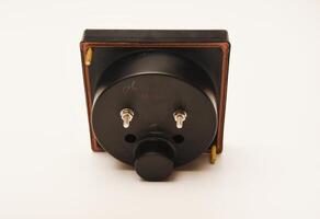 Measuring device. An old voltmeter. Arrow voltage meter. photo