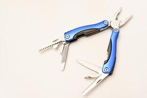 Multitool on a white background. Pocket multi-tool. Saw, knife and pliers. photo