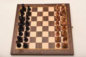 Black and white chess. Wooden chess on a board. A chess game. photo