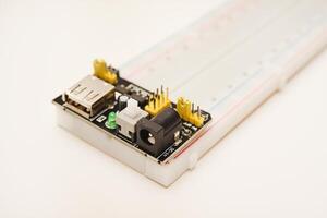 A solderless breadboard for electronics. An assembly tool for radio amateurs. photo