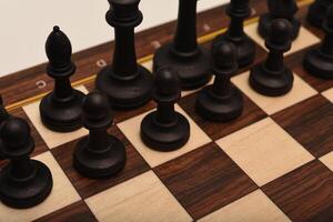 Black and white chess. Wooden chess on a board. A chess game. photo