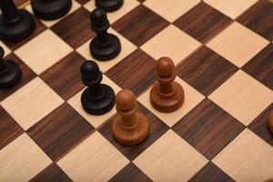 Black and white chess. Wooden chess on a board. A chess game. photo
