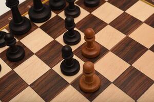 Black and white chess. Wooden chess on a board. A chess game. photo