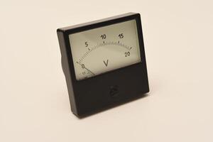 Measuring device. An old voltmeter. Arrow voltage meter. photo