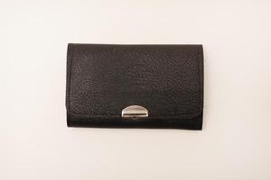 A leather purse with a screwdriver and bits. A set of different screwdrivers. photo