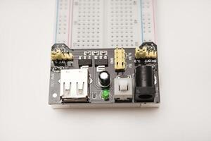 A solderless breadboard for electronics. An assembly tool for radio amateurs. photo