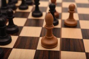 Black and white chess. Wooden chess on a board. A chess game. photo