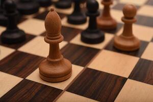 Black and white chess. Wooden chess on a board. A chess game. photo