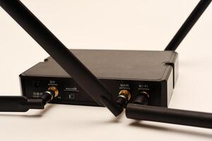 GSM modem. An Internet station with a SIM card. A black router on a white background. photo