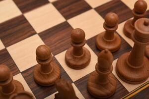 Black and white chess. Wooden chess on a board. A chess game. photo