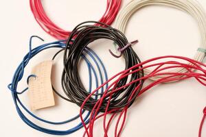 Coils of multicolored wires for electronics. Wires for devices. photo