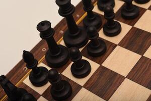 Black and white chess. Wooden chess on a board. A chess game. photo