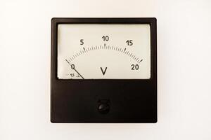 Measuring device. An old voltmeter. Arrow voltage meter. photo