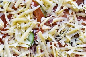 Cooking meat pizza. Pizza toppings before frying. photo