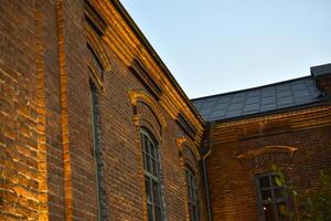 Classic windows in a red brick house. Beautiful classic brick house. photo