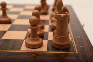 Black and white chess. Wooden chess on a board. A chess game. photo