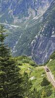 A little red train going up the mountain photo