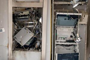 Disassembled electronic equipment inside a maintenance area showcasing intricate components and wiring details photo