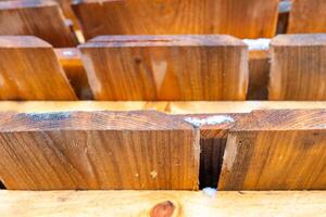 Wooden blocks arranged neatly, showcasing craftsmanship and natural texture in a workspace photo