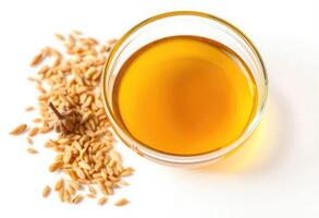 A glass of oil and a bowl of rice on a white background photo