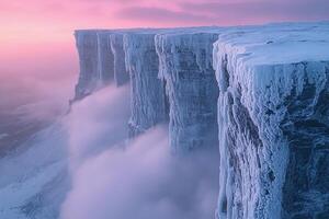 A large ice cliff with snow on top photo