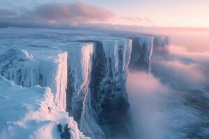 A large ice cliff with snow on top photo