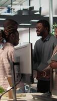 Vertical Forecast affiliates reviewing objectives data and performance metrics in a modern office, focusing on corporate strategy and decision making for sustainable enterprise development. Camera B. video