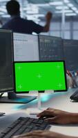 Vertical Data center programmer using mockup tablet, maintaining company network infrastructure, close up. Server hub worker ensuring optimal system performance with isolated screen device, camera A video