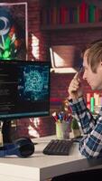 AI software developer at computer waiting for code to finish compiling, rubbing forehead with pen, feeling bored. Impatient man waits for artificial intelligence scripts to finish compiling, camera A video