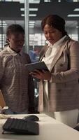 Vertical Businesspeople colleagues strategize a plan at a modern workplace, focusing on company goals by developing a sustainable enterprise strategy to achieve corporate success and objectives. Camera B. video