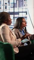 Vertical Multiethnic female managers getting in a fight and screaming at each other, angry and frustrated about the crisis. Businesswomen being furious and upset, disappointed enterprise failure. Camera A. video