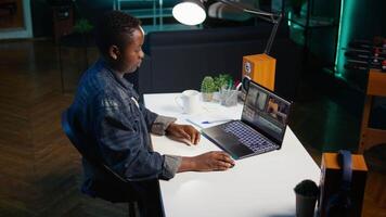 editor analyzing film montage on laptop screen before editing color grading and lighting in creative office. Post production studio employee working with raw footage on notebook, camera B video