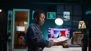Self employed woman checking statistical data financial graphs on laptop screen, researching insights. Remote worker comparing business graphic economic figures, making strategy, camera B video