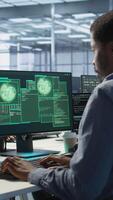 Vertical Cybersecurity team monitoring security incidents, alerted by security breach alert, working together to get rid of virus, protecting infrastructure from threats, camera A video