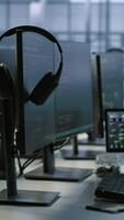 Vertical Artificial intelligence applications used in data center workplace to maintain company network equipment, handheld camera shot. AI programs used in server room to ensure optimal system performance video