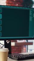 Focus on AI LLM chatbot PC GPT software on PC monitor in home office. Panning shot of large language model application on computer display communicating with user through artificial intelligence video