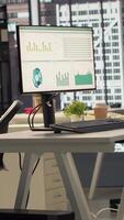 Vertical Empty business office with cubicles used in organizational activity efficiency, having advanced tech gadgets to serve a corporation with luxurious city center headquarters. Corporate culture. video