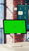 Man in home office uses AI program turning text prompt into videos next to isolated screen tablet. Person using text to generative models on computer and chroma key device, camera B