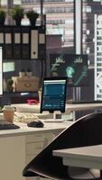 Vertical Empty corporate workspace equipped with advanced tools to serve an enterprise activity, office in a modern city center corporation. Global organization with luxurious workstations and modern gadgets. video