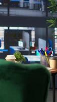 Vertical Empty office space showcases a monitor with financial data during meetings, running detailed infographics in a high end decorated workspace. Develop business strategies for success. video