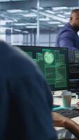 Vertical Woman requesting help from cybersecurity team after seeing security incidents affecting data center network system, protecting infrastructure from hacker attacks, camera A video