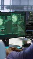 Vertical Surprised data center technician celebrating after successfully managing to install cybersecurity framework, reducing security incidents and enhancing data protection protocols, camera A video