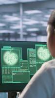 Vertical Woman seeing critical error on PC screen in data center, requesting help from cybersecurity team. Employee seeing security incidents affecting server room network system, camera A video