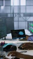 Vertical Computer scientists in data center implementing AI predictive maintenance systems. Server farm employees using artificial intelligence to identify hardware failures impacting operations, camera A video