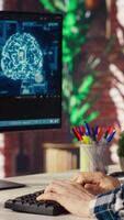 Freelancing computer engineer doing maintenance on artificial intelligence systems, closeup. Remote tech support specialist at working from home, doing checkup on AI systems, camera B video