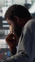 Vertical Black corporate team collaborate on global investment strategy, employing their extensive business expertise to work on data driven decisions. Solving administrative tasks for efficiency. Camera A. video