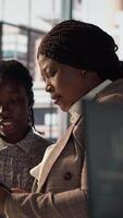 Vertical Business associates reviewing objectives data and performance metrics in a modern office, focusing on corporate strategy and decision making for sustainable enterprise development. Camera A. video