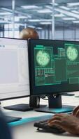Vertical Cybersecurity division workers in server room protecting equipment from hacker stealing data. Data center IT specialists struggling to delete virus attacking company servers, doing brainstorming video