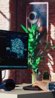 Teleworking programmer using computer for artificial intelligence computing through self learning algorithms. Remote worker working with AI deep neural networks on desktop PC, camera B video